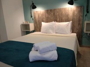 A bed or beds in a room at Aitherial Summer House