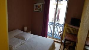 Postel nebo postele na pokoji v ubytování Hôtel Confort
