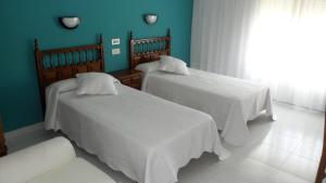 Posteľ alebo postele v izbe v ubytovaní Hostal La Paz + 8 fotografií