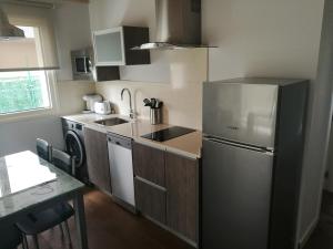 Kuchyň nebo kuchyňský kout v ubytování Apartamentos La Encina