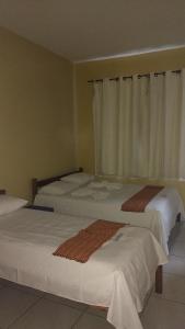 Krevet ili kreveti u jedinici u objektu Hotel Brasil