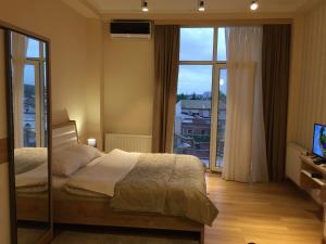 Postel nebo postele na pokoji v ubytování Happy Stay Hotel