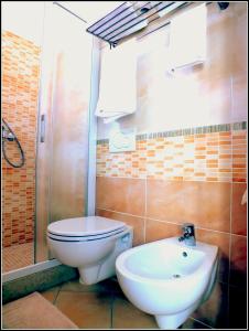 Koupelna v ubytování Hotel Luana