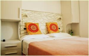 Postel nebo postele na pokoji v ubytování Hotel Luana