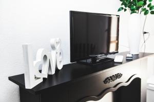 TV a/nebo společenská místnost v ubytování Casa Marzia Affittacamere