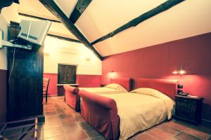 En eller flere senge i et værelse på Agriturismo Antica Sosta
