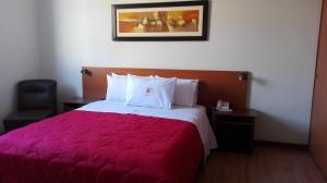 
Cama o camas de una habitación en My Rouse Hotel
