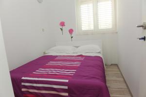 Postel nebo postele na pokoji v ubytování Apartments Neda