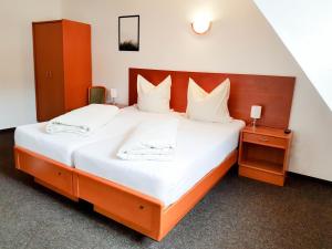 Postel nebo postele na pokoji v ubytování Gasthof Sauerwald