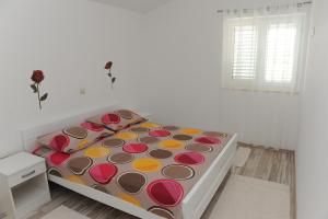 Postel nebo postele na pokoji v ubytování Apartments Neda