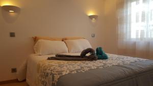 Кровать или кровати в номере Apartamento Cardoso II. A 5 minuto a pé da praia do Peneco