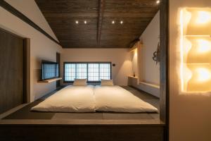 Ліжко або ліжка в номері Hinaya Gojo