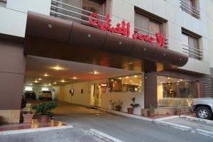 a building with a sign on top of it at Velvet Inn Jeddah in Jeddah