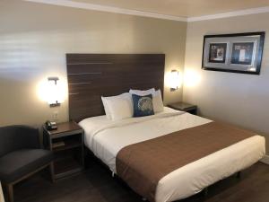 Postel nebo postele na pokoji v ubytování El Castell Motel