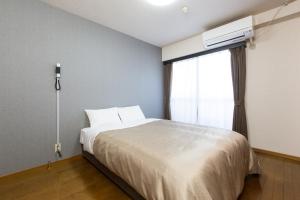 Voodi või voodid majutusasutuse Global Resort ONO de LUNE toas
