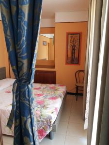 Ein Bett oder Betten in einem Zimmer der Unterkunft Casa Vacanze Nonna Gina