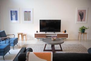 
A television and/or entertainment center at Banksia Villa
