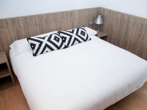 Postel nebo postele na pokoji v ubytování Hotel Restaurante Cadosa
