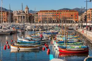 a bunch of boats are docked in a harbor at Port de Nice in Nice