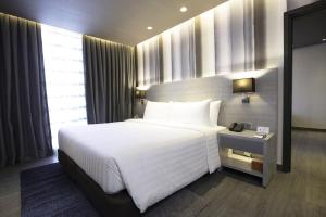 bai Hotel Cebu客房内的一张或多张床位