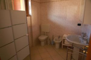 Koupelna v ubytování Casa "Giardino sulla Baia"