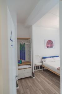 Posteľ alebo postele v izbe v ubytovaní Nonna Pina Art Rooms