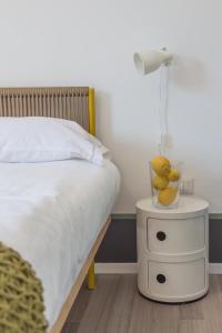Posteľ alebo postele v izbe v ubytovaní Nonna Pina Art Rooms