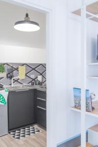 Kuchyňa alebo kuchynka v ubytovaní Nonna Pina Art Rooms