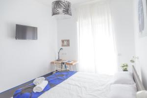 Posteľ alebo postele v izbe v ubytovaní Nonna Pina Art Rooms