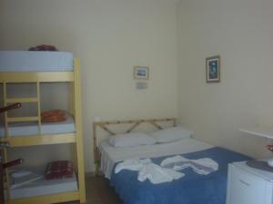 En eller flere senge i et værelse på Pousada Oceanica