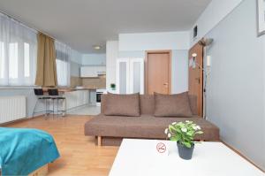 a living room with a couch and a table at Agape Apartments in Budapest