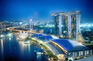 a view of a city at night with buildings at Wanderloft Capsule Hostel in Singapore