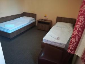 Posteľ alebo postele v izbe v ubytovaní Hotel Polonia