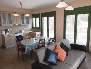 a living room with a couch and a table at Porto Katsiki Blu in Athani +37 photos
