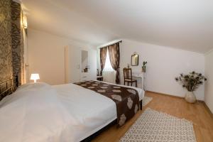 Posteľ alebo postele v izbe v ubytovaní Apartmani Godinić