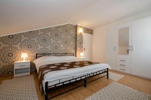 Posteľ alebo postele v izbe v ubytovaní Apartmani Godinić