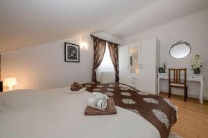 Posteľ alebo postele v izbe v ubytovaní Apartmani Godinić