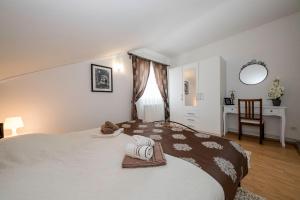 Posteľ alebo postele v izbe v ubytovaní Apartmani Godinić