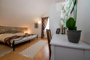 Posteľ alebo postele v izbe v ubytovaní Apartmani Godinić