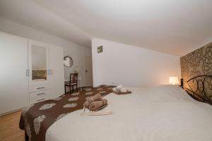 Posteľ alebo postele v izbe v ubytovaní Apartmani Godinić