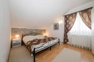Posteľ alebo postele v izbe v ubytovaní Apartmani Godinić