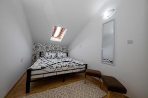 Posteľ alebo postele v izbe v ubytovaní Apartmani Godinić