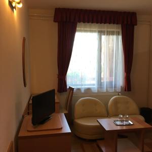 TV a/nebo společenská místnost v ubytování Motel Sora