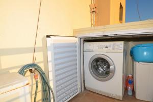 a washing machine sitting next to a washer at Elios Villa Chalkidiki in Skala Fourkas