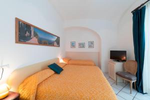 Postel nebo postele na pokoji v ubytování Mimì B&B