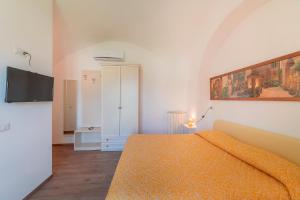 Postel nebo postele na pokoji v ubytování Mimì B&B