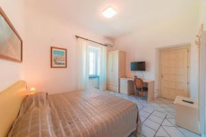 Postel nebo postele na pokoji v ubytování Mimì B&B