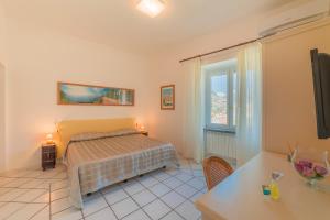 Postel nebo postele na pokoji v ubytování Mimì B&B