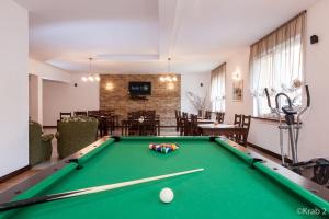 a room with a pool table and a dining room at KRAB 2 in Rewal