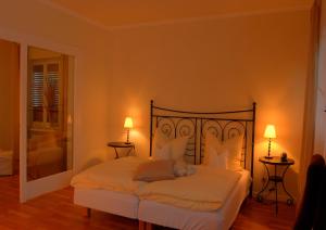 a bedroom with a bed with a teddy bear on it at Alte Brauerei Kasbachtal in Kasbach-Ohlenberg +1 photo